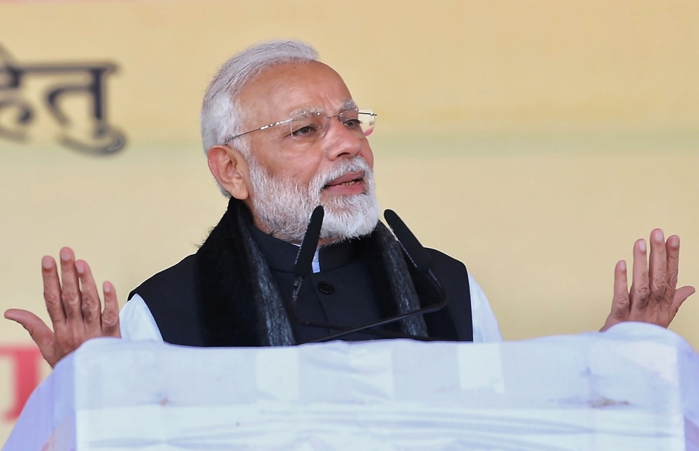 Indian Prime Minister Narendra Modi speaks during the inauguration and foundation stone laying ceremony of various development projects in Jhansi in the Indian state of Uttar Pradesh on Friday. — AFP