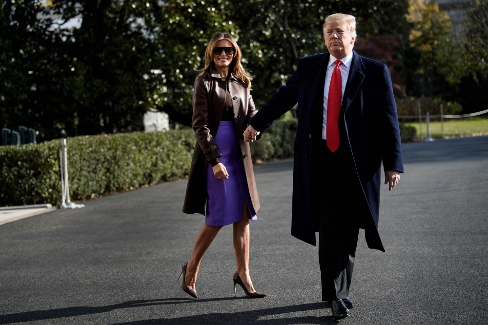 US First Lady Melania Trump and US President Donald Trump walk to Marine One on the South Lawn of the White House in Washington in this Nov. 29, 2018 file photo. — AFP