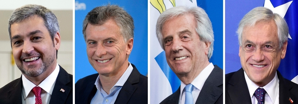 Composition created on Thursday with file pictures of (L-R) Paraguay's President Mario Abdo Benitez, Argentina's President Mauricio Macri, Uruguay's President Tabare Vazquez and Chile's President Sebastian Pinera. Uruguay, Argentina, Paraguay and Chile are to submit a joint bid to host the 2030 World Cup, Chile's President Sebastian Pinera announced. Argentina, Paraguay and Uruguay had already submitted a joint bid to host the centenary edition of football's most prestigious tournament, but Pinera said on Twitter that those countries' presidents had agreed to Chile's participation in the 