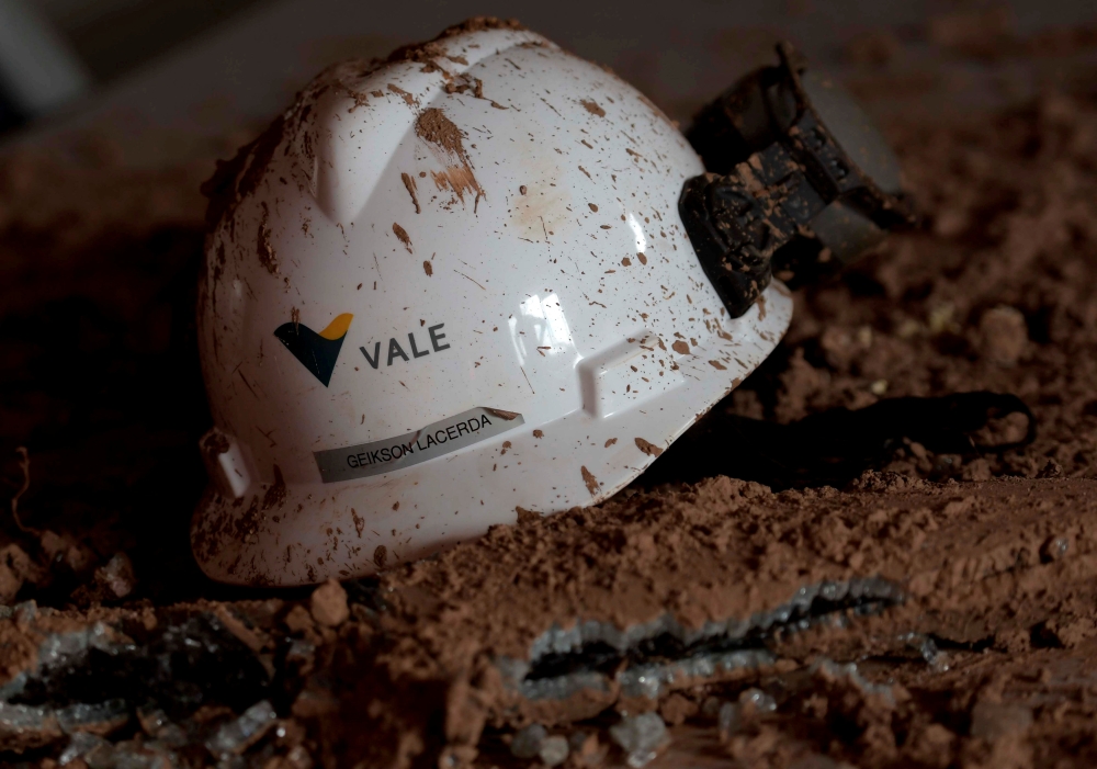 A helmet with a logo of Vale SA is seen in a collapsed dam owned by the company, in Brumadinho, Brazil, in this Feb. 13, 2019 file photo. — Reuters