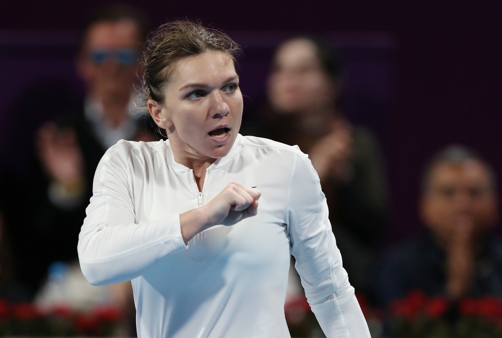 Romania's Simona Halep celebrates winning her Qatar Open semifinal match against Ukraine's Elina Svitolina at the Khalifa International Tennis and Squash Complex, Doha, Qatar, on Friday. — Reuters