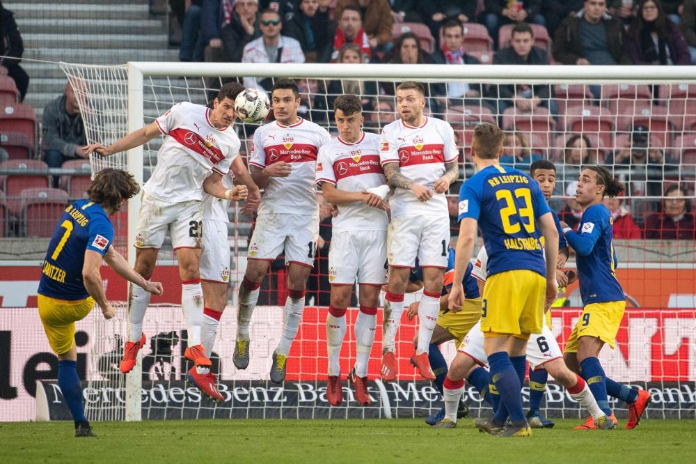 Leipzig's midfielder Marcel Sabitzer (L) scores from a freekick during the German first division Bundesliga football match against VfB Stuttgart in Stuttgart Saturday. — AFP 
