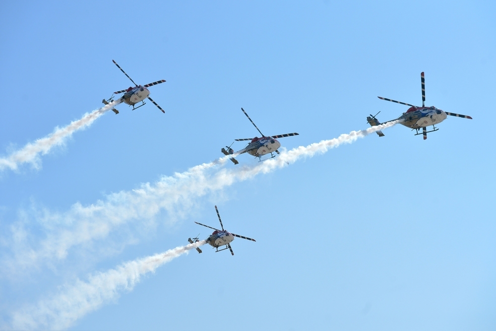 International delegates watch aircraft perform aerobatics during a flying display on the inaugural day of the five-day Aero India 2019 airshow at the Yelahanka Air Force station in Bangalore, India, on Wednesday. — AFP