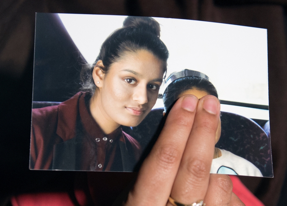 Renu Begum, sister of teenage British girl Shamima Begum, holds a photo of her sister as she makes an appeal for her to return home at Scotland Yard, in London, back in 2015.— Reuters 