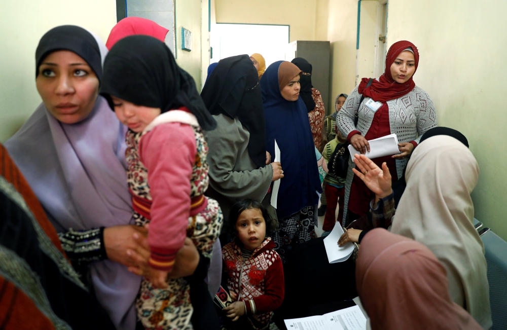 A family planning adviser speaks with Egyptian mothers at a new clinic in the province of Fayoum, southwest of Cairo, Egypt, on Thursday. — Reuters