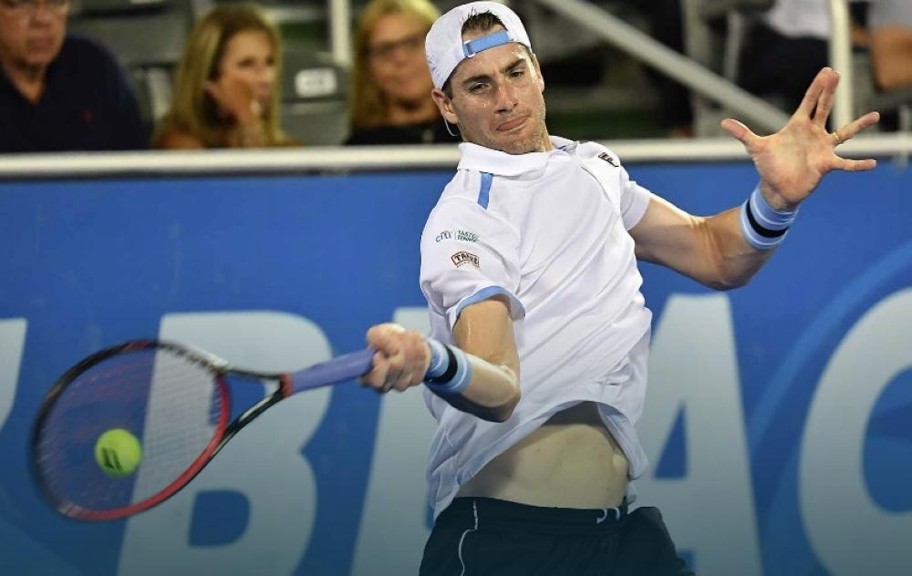 John Isner booked a quarterfinal berth at the ATP Delray Beach Open on Wednesday with victory over Slovakia's Lukas Lacko.