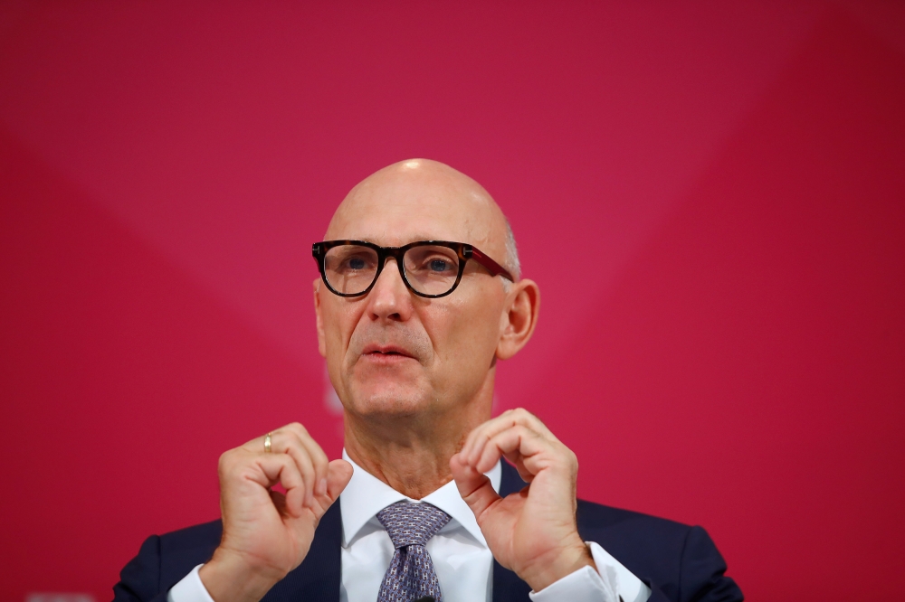 Timotheus Hoettges, CEO of German telecommunications company Deutsche Telekom AG, gestures as he speaks at the company's annual news conference in Bonn, Germany, on Thursday. — Reuters
