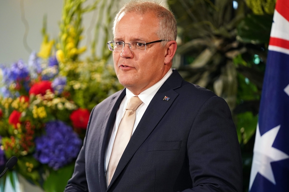 Australia's Prime Minister Scott Morrison speaks during a joint press conference with his New Zealand counterpart Jacinda Ardern in Auckland on Friday. — AFP