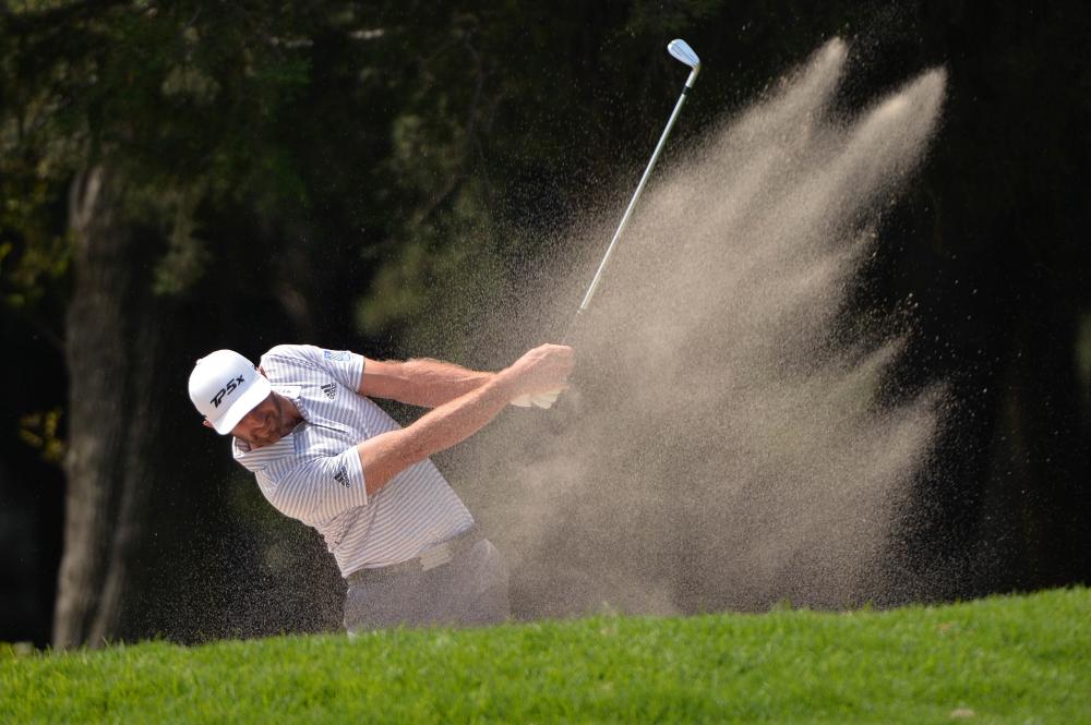 Dustin Johnson plays his second shot on the fourth hole during the third round of the WGC-Mexico Championship Golf Tournament at Club de Golf Chapultepec in Mexico City Saturday. — Reuters