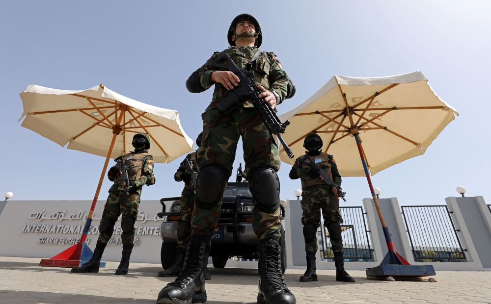 Members of Egyptian security forces stand guard before the start of a summit between Arab League and European Union member states in the Red Sea resort of Sharm El-Sheikh, Egypt, Sunday. — Reuters