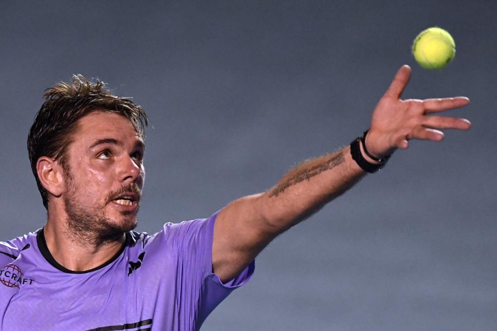 


Swiss tennis player Stan Wawrinka is set to serve against Ryan Harrison of the US during their Mexico ATP 500 Open in Acapulco, Mexico, Monday. — AFP 