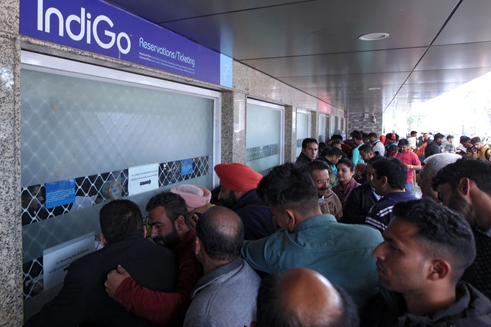 Stranded passengers queue at airline counters at Jammu airport in Jammu on Wednesday following the shut down of the airspace for commercials flights north of Delhi as tensions increase with Pakistan. — AFP