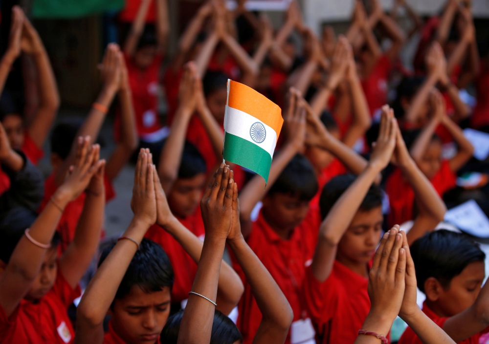 School children offer prayers for the release of an Indian Air Force pilot after he was captured by Pakistan, inside a school in Ahmedabad, India, on Thursday. — Reuters