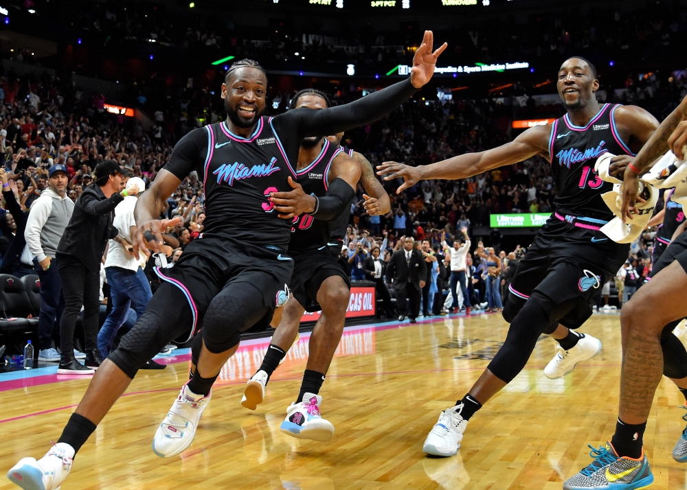 Miami Heat guard Dwyane Wade (3) celebrates after making the game winning basket against the Golden State Warriors during the second half at American Airlines Arena. — Reuters