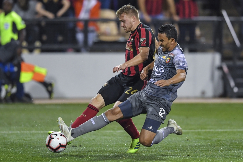 Atlanta United defender Julian Gressel (24) shoots the ball past CS Herediano midfielder Randall Azofeifa (12) during the second half at Fifth Third Bank Stadium. — Reuters