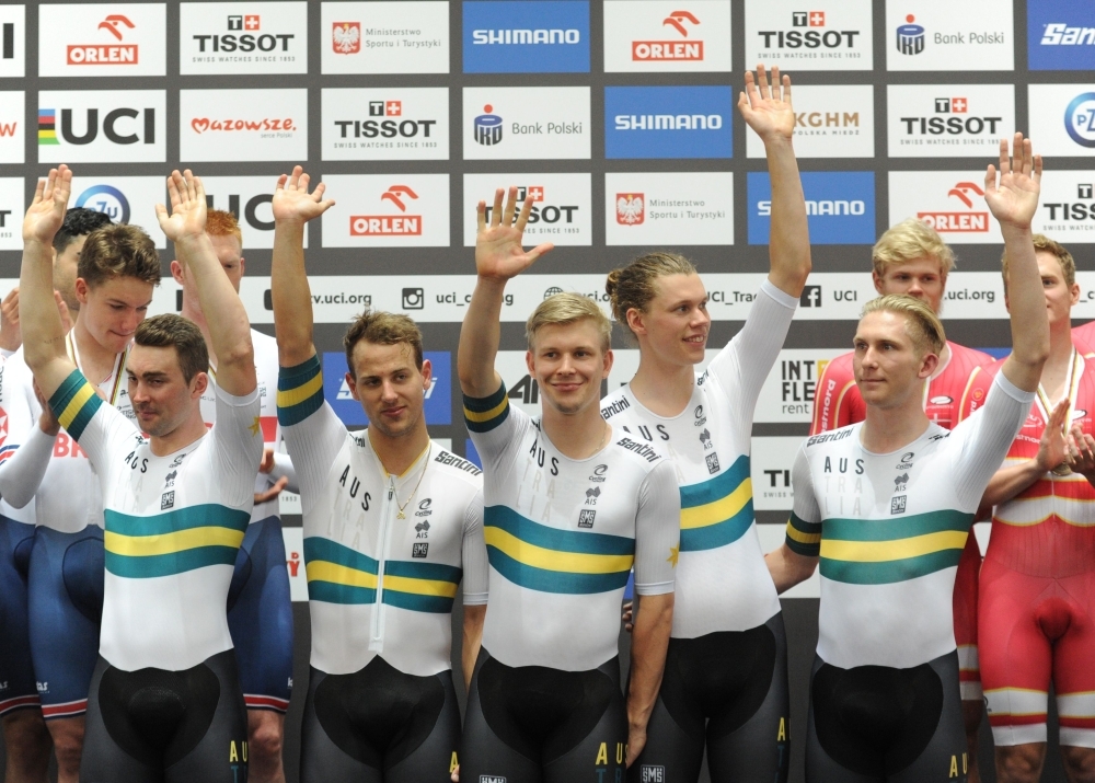 World champions team Australia's cyclists Samuel Welsford, Kellard O'Brien, Leigh Howard, Alexander Porter and Cameron Scott celebrate celebrate during the award ceremony after winning the Men's Team Pursuit Final race on the UCI Track Cycling World Championships in Pruszkow on Thursday. — AFP
