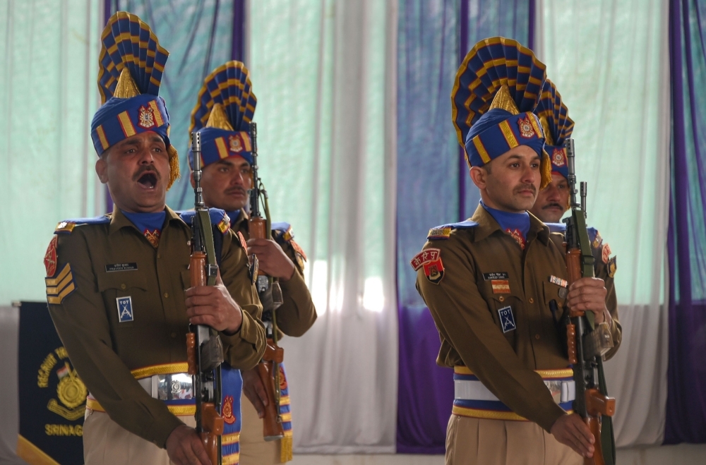 Indian paramilitary troopers pay homage to two slain paramilitary colleagues at a wreath laying ceremony at the Central Reserve Police Force (CRPF) headquarters in Srinagar on Saturday following a gunfight at Babagund village of Handwara in Kashmir's Kupwara district. — AFP