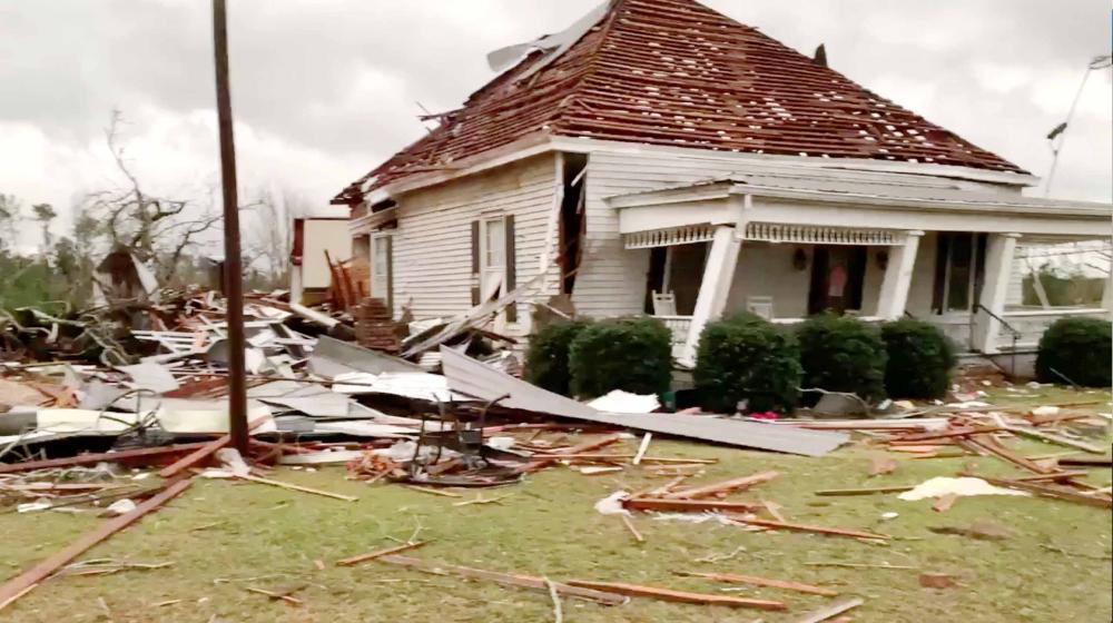 


Debris and a damaged house seen following a tornado in Beauregard, Alabama, US in this Sunday still image obtained from social media video. — Reuters