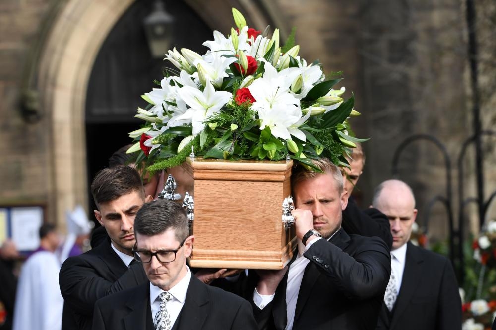 Pallbearers Chesterfield goalkeeper Joe Anyon (L) and Leicester goalkeeper Kasper Schmeichel (R) carry the coffin out of Stoke Minster church after the funeral service of England's former goalkeeper Gordon Banks in Stoke-on-Trent, central England, Monday. — AFP 