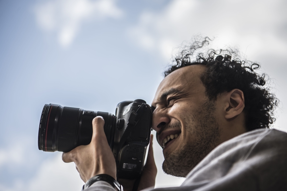 


Egyptian photojournalist Mahmoud Abu Zeid, widely known as Shawkan, carries a camera at his home in the capital Cairo, Monday. — AFP photos