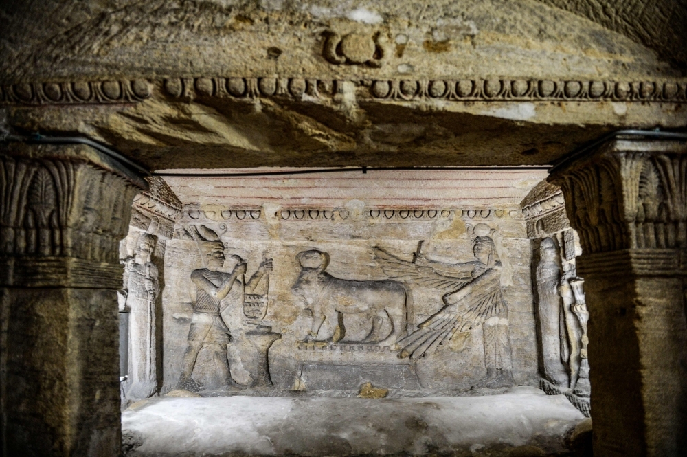 


A view from inside the catacombs of Kom El-Shoqafa (Mound of Shards), dating to the Roman period (1st-4th centuries AD) in the center of the Mediterranean coastal city of Alexandria, during the inauguration of a project to drain groundwater from the archeological site. — AFP photos