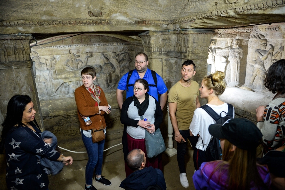 


A view from inside the catacombs of Kom El-Shoqafa (Mound of Shards), dating to the Roman period (1st-4th centuries AD) in the center of the Mediterranean coastal city of Alexandria, during the inauguration of a project to drain groundwater from the archeological site. — AFP photos