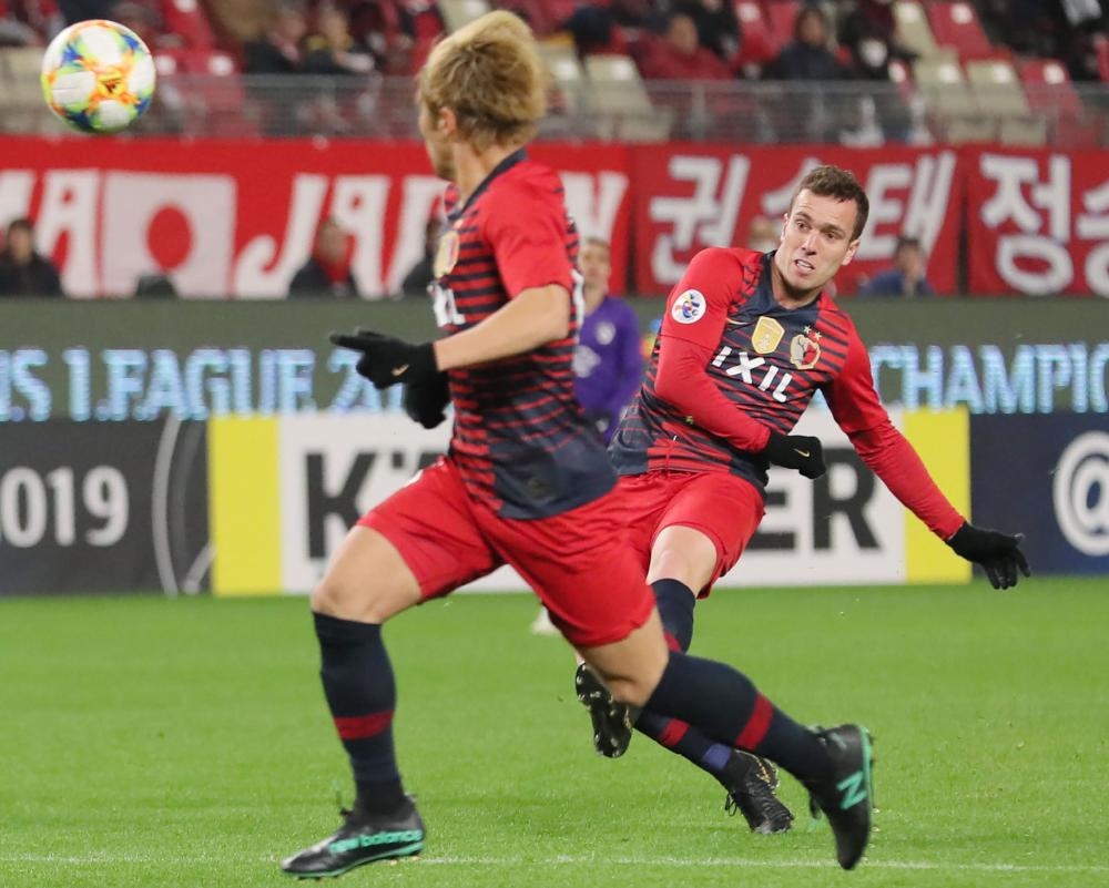 Kashima Antlers’ midfielder Serginho (R) scores during their Asian Champions League Group E match against Malaysian club Johor Darul Ta’zim at the Kashima Stadium in Kashima Tuesday. — AFP