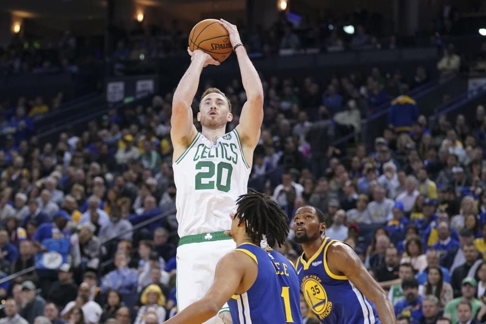 Boston Celtics’ forward Gordon Hayward shoots against Golden State Warriors’ guard Damion Lee during their NBA game at Oracle Arena in Oakland Tuesday. — Reuters