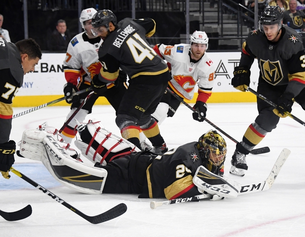 Marc-Andre Fleury No. 29 of the Vegas Golden Knights dives on the puck to make a save in the third period of a game against the Calgary Flames at T-Mobile Arena on Wednesday in Las Vegas, Nevada. The Golden Knights defeated the Flames 2-1. — AFP