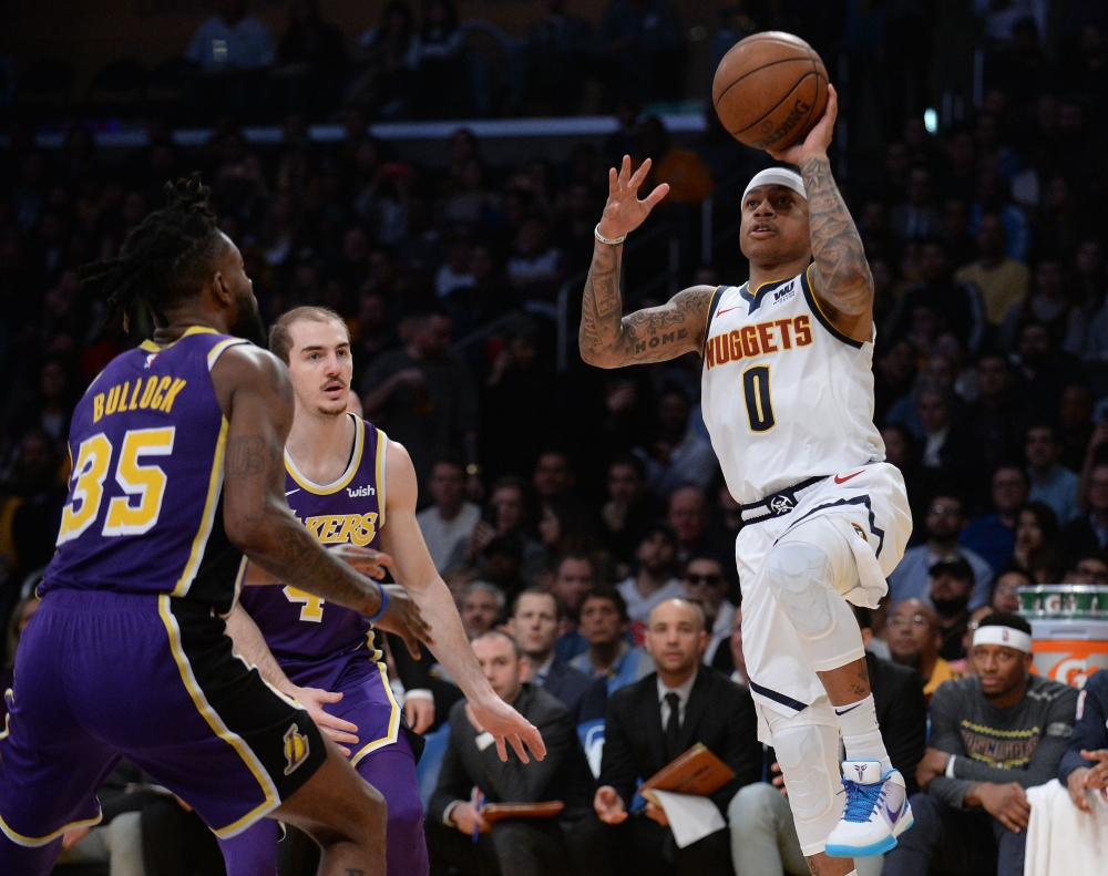 Denver Nuggets guard Isaiah Thomas (0) shoots against Los Angeles Lakers guard Reggie Bullock (35) during the first half at Staples Center. — Reuters