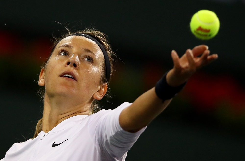 Victoria Azarenka of Belarus serves against Vera Lapko of Belarus during their women's singles first round match on day three of the BNP Paribas Open at the Indian Wells Tennis Garden on Wednesday in Indian Wells, California. — AFP