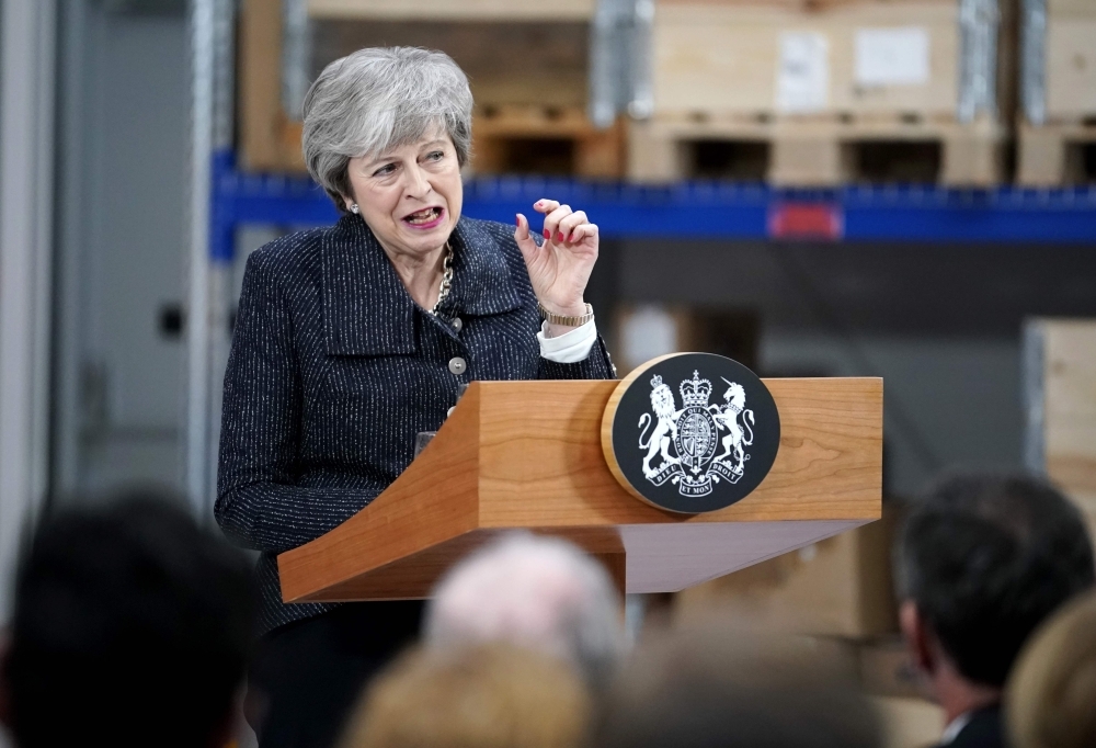 Britain’s Prime Minister Theresa May delivers a speech at Ørsted East Coast Hub in the North Sea fishing port, Grimsby, England, on Friday. — AFP