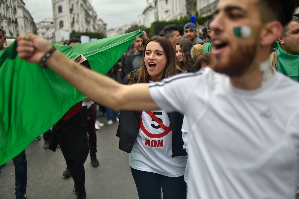 Algerian protesters demonstrate against their ailing president’s bid for a fifth term in power in Algiers on Friday. — AFP