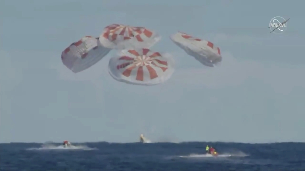 An unmanned capsule of the SpaceX Crew Dragon spacecraft splashes down into the Atlantic Ocean, after a short-term stay on the International Space Station, in this still image from video, in the Atlantic, about 200 miles off the Florida coast, on Friday. — Reuters