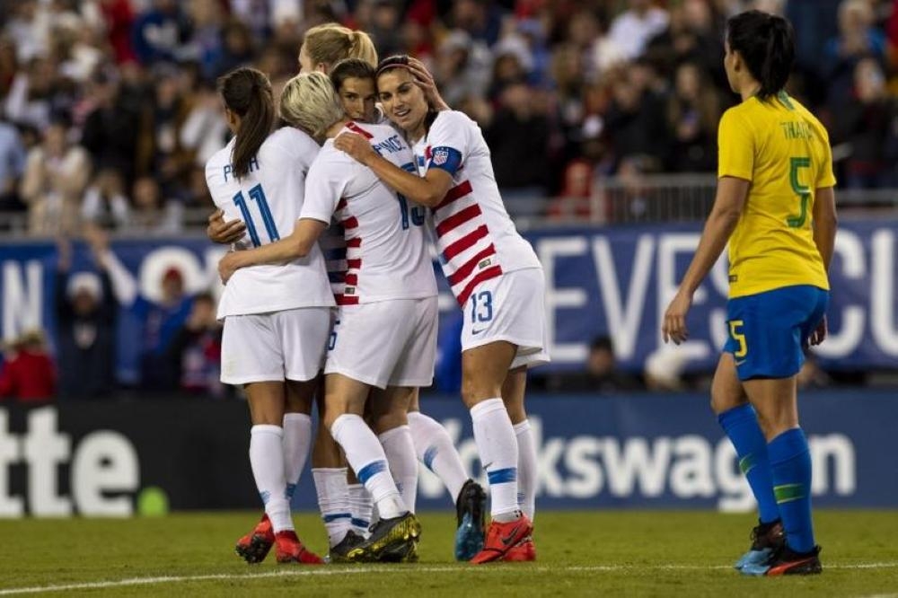 United States forward Tobin Heath (17) and forward Alex Morgan (13) celebrate after a goal during the first half against Brazil during a She Believes Cup women's soccer match at Raymond James Stadium. — Reuters