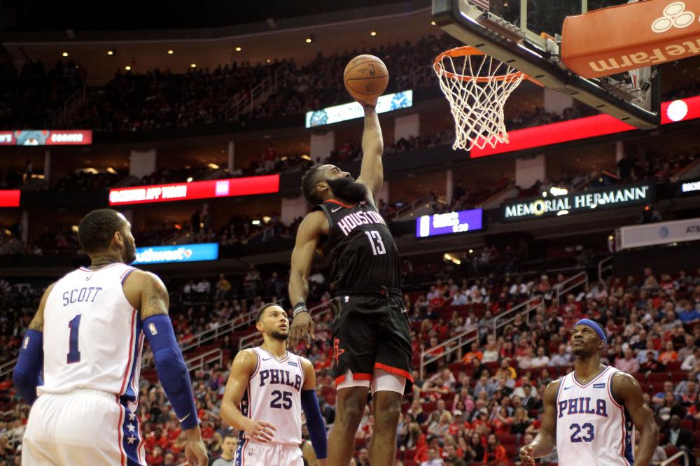 Houston Rockets’ guard James Harden goes up for a dunk against the Philadelphia 76ers during their NBA game at Toyota Center in Houston Friday. — Reuters 