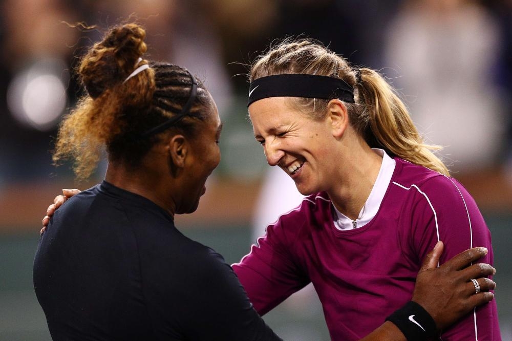 Serena Williams of the US shares a moment with Victoria Azarenka of Belarus after their match of the BNP Paribas Open at the Indian Wells Tennis Garden in California Friday. — AFP 