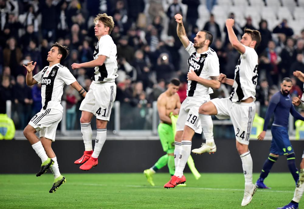 Juventus players celebrate after beating Udinese in a Serie A match at Allianz Stadium in Turin Friday. — Reuters