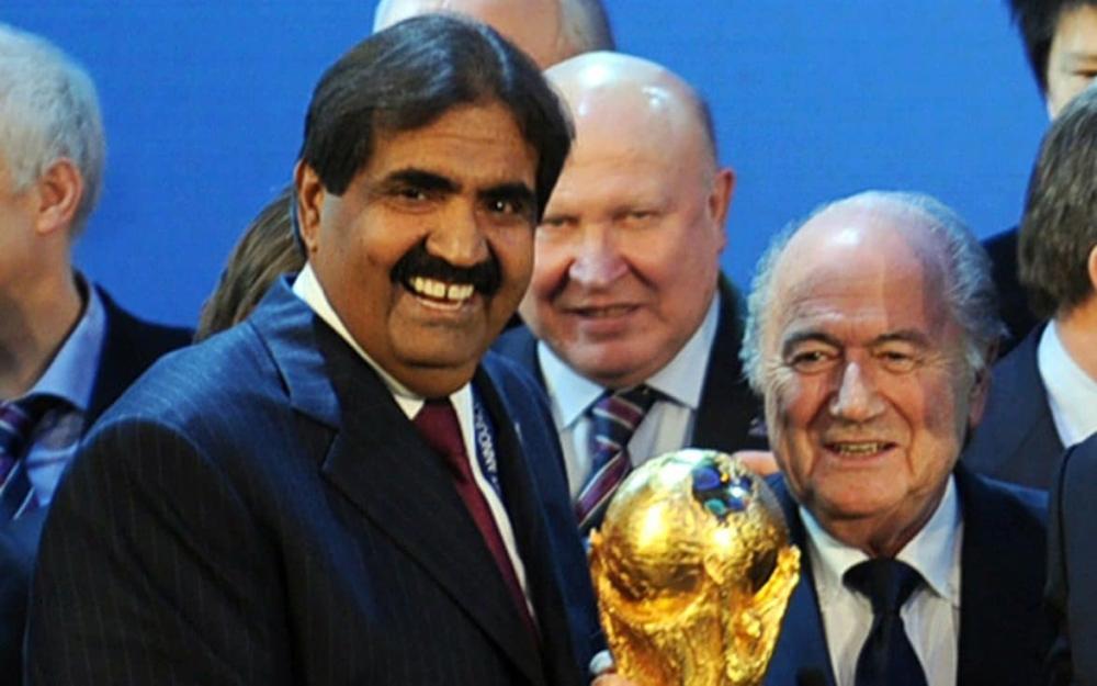 Emir of the State of Qatar Sheikh Hamad bin Khalifa Al-Thani and former Fifa President Joseph Blatter pose with the World Cup following the announcement that Qatar will host 2022 World Cup.  