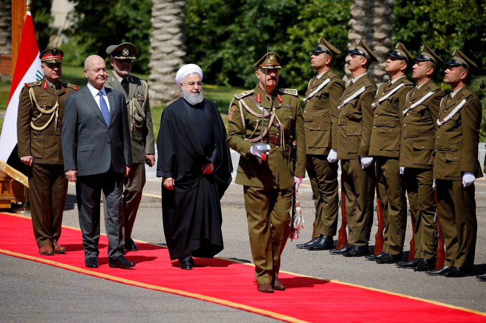 


Iraq’s President Barham Salih walks with Iranian President Hassan Rohani during a welcome ceremony at Salam Palace in Baghdad, Monday. — Reuters