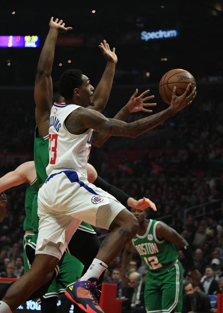 Los Angeles Clippers’ guard Lou Williams moves to the basket against Boston Celtics during their NBA game at Staples Center in Los Angeles Monday. — Reuters 