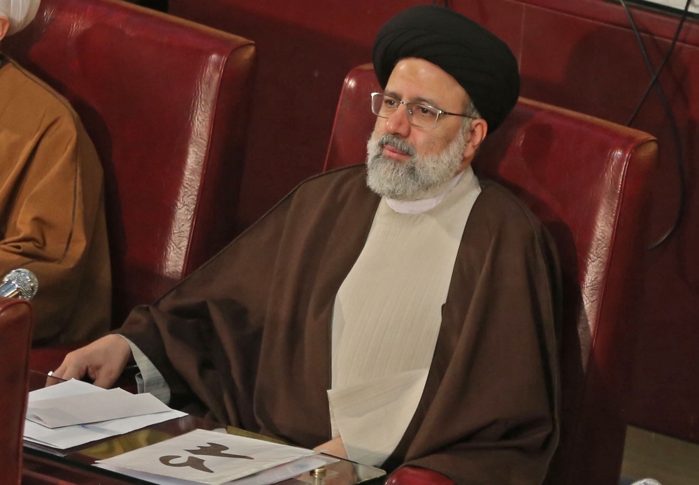 


Newly appointed Iranian new judiciary chief ultra-conservative cleric Ebrahim Raisi attends a session of Iran’s influential experts assembly in Tehran, Tuesday. — AFP