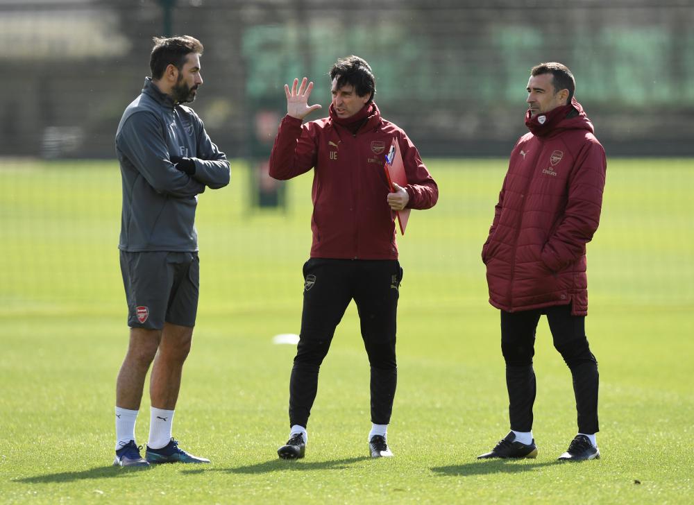 Arsenal manager Unai Emery (C) with head of performance Shad Forsythe and first team assistant coach Juan Carlos Carcedo during a training session. — Reuters