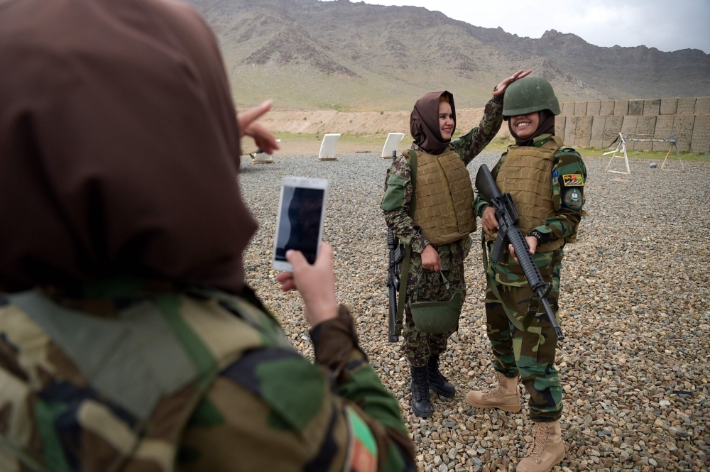 Afghan National Army (ANA) female soldiers pose for photographs after a live firing exercise at the Kabul Military training center (KMTC) on the outskirts of Kabul in this May 3, 2017 file photo. — AFP