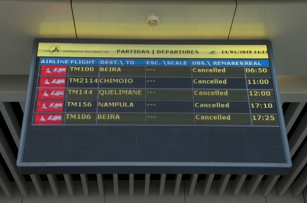 A Departures electronic panel indicating that all flights are canceled is seen at the Maputo International Airport in Mozambique on Thursday. — AFP