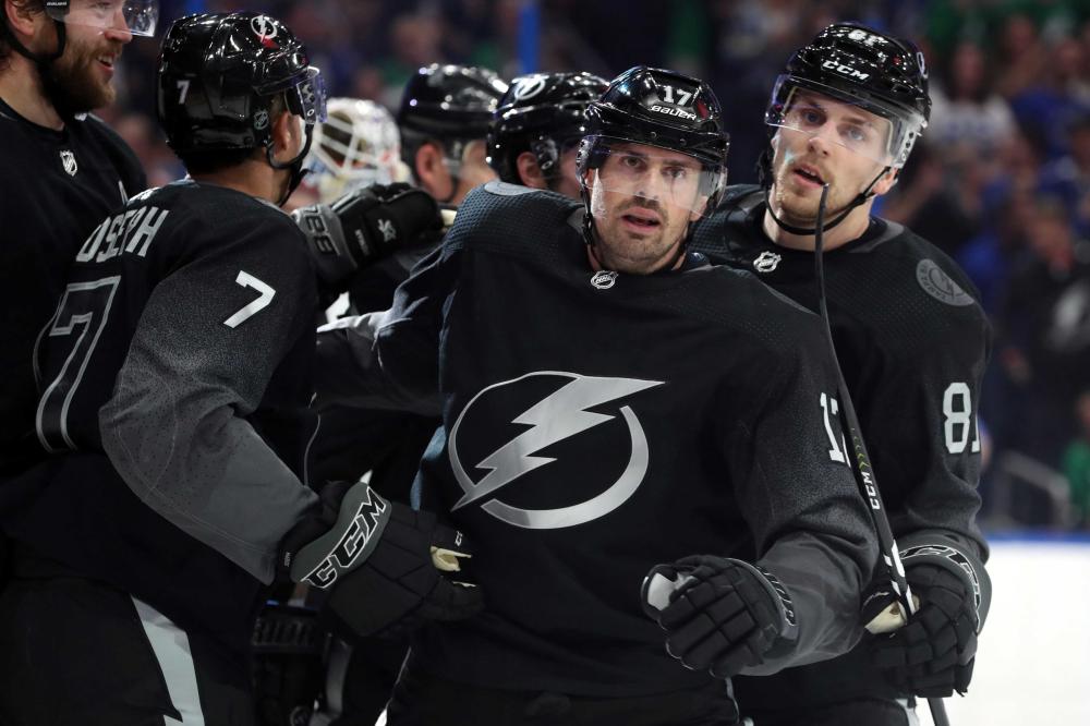 Tampa Bay Lightning’s left wing Alex Killorn (17) is congratulated by teammates after he scored a goal against the Washington Capitals during their NHL game at Amalie Arena in Tampa Saturday. — Reuters