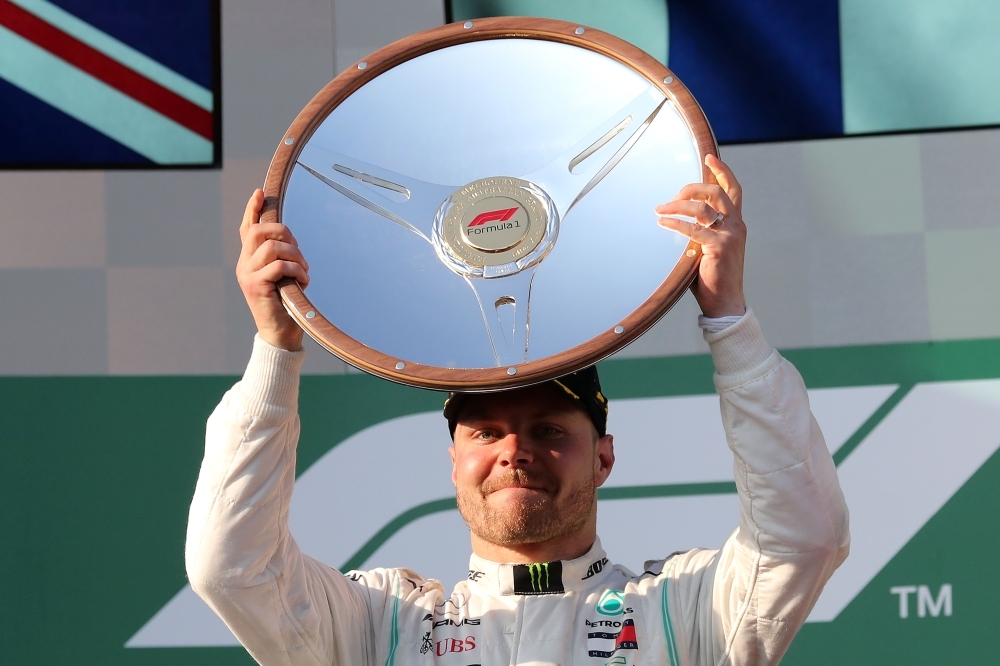 


Finnish driver Valtteri Bottas of Mercedes celebrates on the podium after winning the Formula One Australian Grand Prix in Melbourne Sunday. — AFP