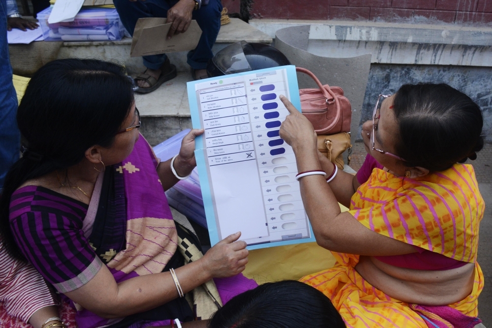 An Indian official recruited for polling duties inspects voting materials ahead of elections in Agartala, Tripura, in this Feb. 16, 2018 file photo. — AFP