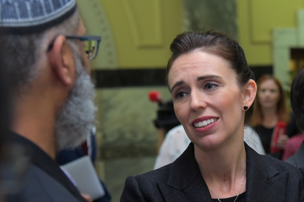 New Zealand Prime Minister Jacinda Ardern meets with Muslim community leaders after the Parliament session in Wellington on Tuesday. — AFP