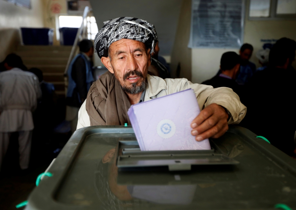 An Afghan man casts his vote during the parliamentary election at a polling station in Kabul, Afghanistan, in this Oct. 21, 2018 file photo. — Reuters